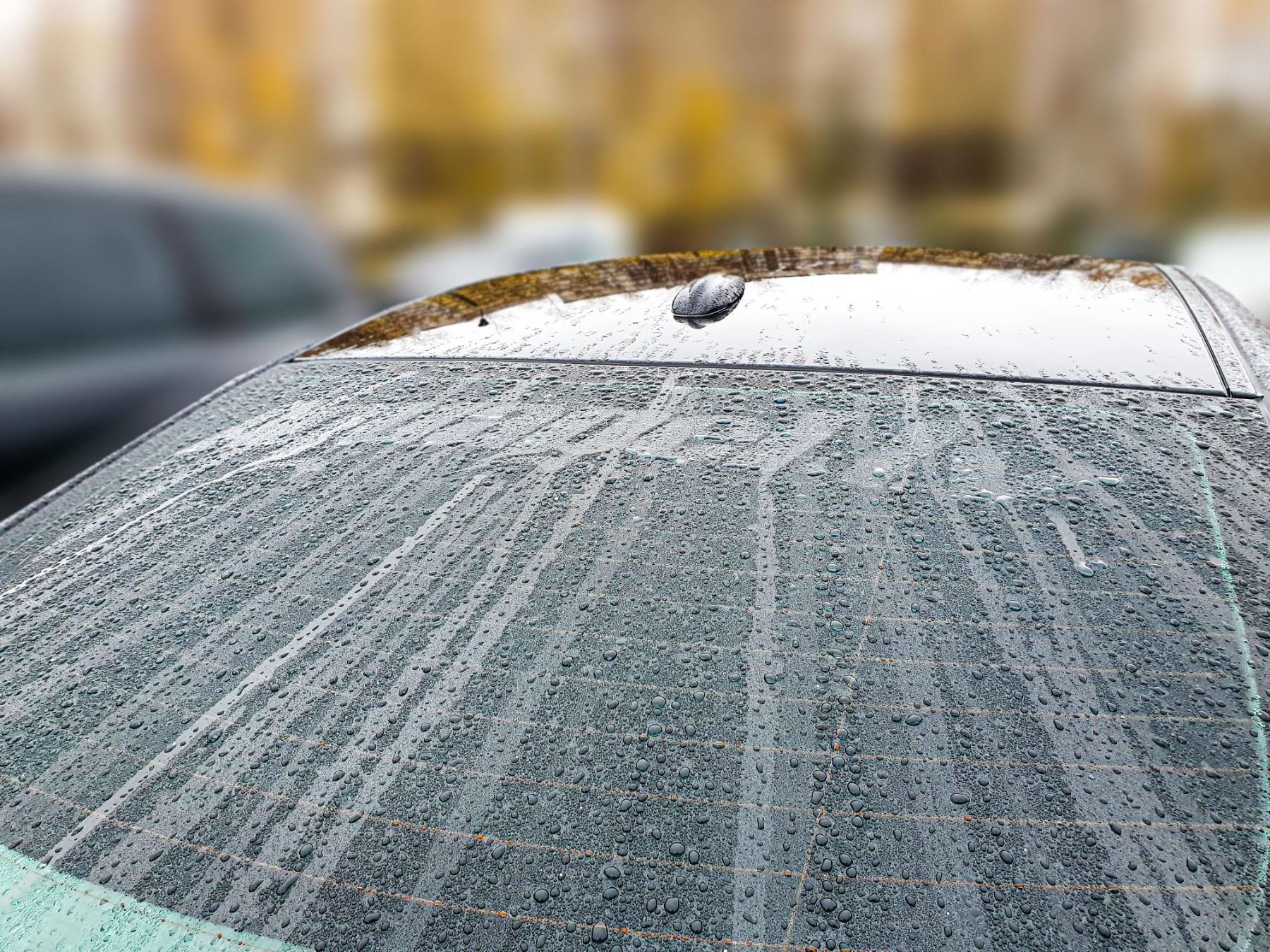 Water beading on car glass treated with Aquapel